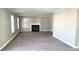 Open concept living room with fireplace, gray walls, and light wood-look floors at 4271 Winston Cir, South Fulton, GA 30349