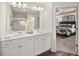 Elegant bathroom with dual vanities, modern lighting, and a walk-in shower at 6322 Rosetta Dr # 1, South Fulton, GA 30331