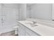 Bright bathroom featuring a shower-tub combo, a white vanity with a sink, and a large mirror at 650 Cayenne Way, Lawrenceville, GA 30045