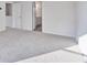 Bright bedroom with plush carpet and access to an ensuite bathroom at 650 Cayenne Way, Lawrenceville, GA 30045
