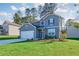 Charming two-story home with well-manicured lawn, attached garage, and inviting curb appeal at 650 Cayenne Way, Lawrenceville, GA 30045