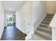 Inviting foyer with wood flooring, staircase, and natural light streaming through the front door at 650 Cayenne Way, Lawrenceville, GA 30045