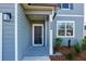 Welcoming front entryway with a classic door, stylish lighting, and modern house number at 650 Cayenne Way, Lawrenceville, GA 30045