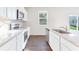 Modern kitchen with stainless steel appliances, white countertops, and an island at 650 Cayenne Way, Lawrenceville, GA 30045