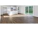 Bright open space with hardwood floors, a sliding glass door, and an eat-in kitchen at 650 Cayenne Way, Lawrenceville, GA 30045