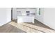 Open-concept kitchen featuring a center island and stainless steel appliances at 650 Cayenne Way, Lawrenceville, GA 30045