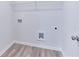 Small laundry room featuring connections for a washing machine and dryer, and a wire rack on the ceiling at 650 Cayenne Way, Lawrenceville, GA 30045