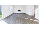 Spacious living room with modern electric fireplace and sliding door access to the backyard at 650 Cayenne Way, Lawrenceville, GA 30045