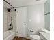 Bathroom featuring tile shower, modern fixtures, toilet, and light green walls at 6851 Roswell Rd # N10, Sandy Springs, GA 30328