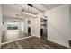 Bright dining area featuring modern lighting, views of the kitchen and living spaces at 6851 Roswell Rd # N10, Sandy Springs, GA 30328