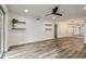 Large living area boasts hardwood floors, sliding glass doors, and minimalist shelves at 6851 Roswell Rd # N10, Sandy Springs, GA 30328