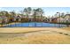 Community tennis court on a sunny day, complete with benches and picnic tables at 6851 Roswell Rd # N10, Sandy Springs, GA 30328