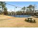 Community tennis court with mature trees in a well-maintained setting at 6851 Roswell Rd # N10, Sandy Springs, GA 30328