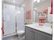 Bathroom featuring a glass enclosed shower, a gray vanity, and modern fixtures at 710 Hudson Way, Roswell, GA 30076