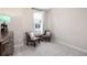 This bedroom features plush carpeting, two chairs near a window, and neutral paint at 710 Hudson Way, Roswell, GA 30076