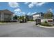 Gated entrance to community with brick pillars and lush landscaping for a welcoming arrival at 710 Hudson Way, Roswell, GA 30076