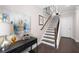 Entry foyer with staircase, dark wood floors, and stylish console table at 710 Hudson Way, Roswell, GA 30076
