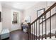 Foyer with hardwood floors, a bench, and a staircase at 710 Hudson Way, Roswell, GA 30076