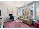 The living room features a decorative rug, colorful pillows, and bright artwork at 710 Hudson Way, Roswell, GA 30076