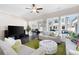 Inviting living room featuring hardwood floors, neutral paint, large windows, and comfortable seating at 710 Hudson Way, Roswell, GA 30076