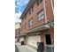 Exterior view of garages, showing driveway and brick exterior with side entrance door at 745 Fountainhead Ne Ln # 130, Atlanta, GA 30324