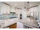 Kitchen featuring stainless steel appliances, gorgeous backsplash, and stone countertops at 2300 Hopehaven Way, Hoschton, GA 30548