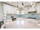 Kitchen featuring stainless steel appliances, gorgeous backsplash, and stone countertops at 2300 Hopehaven Way, Hoschton, GA 30548