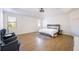 Main bedroom featuring wood floors, natural light, and sitting area at 2300 Hopehaven Way, Hoschton, GA 30548