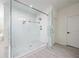 Open glass shower with tile detail, offering a spa-like experience at 2300 Hopehaven Way, Hoschton, GA 30548