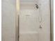 Tiled shower featuring a built-in shower seat and shelf at 2655 Sarah Carlin Ct, Norcross, GA 30071