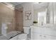 Bright bathroom featuring a shower with glass door and a vanity with marble countertop at 2782 Loftview Sq, Atlanta, GA 30339