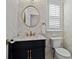 Stylish powder room with floral wallpaper, marble countertop, and round mirror at 2782 Loftview Sq, Atlanta, GA 30339