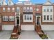 Charming townhome featuring a brick facade, attached garage, and inviting curb appeal with manicured landscaping at 2782 Loftview Sq, Atlanta, GA 30339