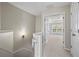 Upstairs hallway leading to a bedroom with tray ceiling and shuttered windows at 2782 Loftview Sq, Atlanta, GA 30339