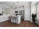 Bright kitchen featuring white cabinets, stainless steel appliances, and an island with bar seating at 2782 Loftview Sq, Atlanta, GA 30339