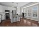 Well-lit kitchen boasting stainless steel appliances, a breakfast bar, and a view of the backyard at 2782 Loftview Sq, Atlanta, GA 30339