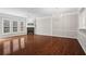 Bright and airy living room featuring hardwood floors, fireplace, large windows and modern light fixtures at 2782 Loftview Sq, Atlanta, GA 30339