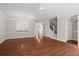 Spacious living room featuring hardwood floors, modern lighting, and neutral color palette at 2782 Loftview Sq, Atlanta, GA 30339