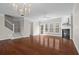 Living room with hardwood floors, fireplace, abundant natural light, and stylish chandelier at 2782 Loftview Sq, Atlanta, GA 30339