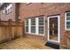 Brick patio featuring a wood deck and windows at 2782 Loftview Sq, Atlanta, GA 30339