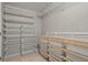 Organized walk-in closet features wire shelving and storage bins for optimal organization at 2782 Loftview Sq, Atlanta, GA 30339