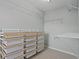 Spacious walk-in closet featuring built-in shelving and drawer organizers for optimal storage at 2782 Loftview Sq, Atlanta, GA 30339