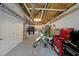 View of the basement with painted floor and storage shelves and a work bench area with lots of available room at 41 Silverthorne Ct, Douglasville, GA 30134