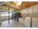 View of the basement with painted floor and white cabinets, laundry machines and storage shelves at 41 Silverthorne Ct, Douglasville, GA 30134