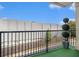 Balcony features outdoor turf, iron railings, and a landscaped view at 849 Perennial Dr, Atlanta, GA 30328