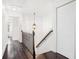 Upstairs hallway with beautiful dark wood floors and a decorative stair railing at 849 Perennial Dr, Atlanta, GA 30328