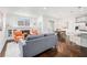 Cozy living room with hardwood flooring, fireplace, and an open layout with an eat-in kitchen at 849 Perennial Dr, Atlanta, GA 30328