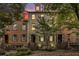 Exterior view of charming brick townhomes with manicured lawns and blue shutters at 849 Perennial Dr, Atlanta, GA 30328