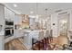 Open kitchen with stainless steel appliances, a center island, and gray cabinets at 367 Reserve Overlook, Canton, GA 30115