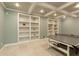 The finished basement provides ample storage space with integrated shelving and entertainment options at 3966 Creekview Ridge Dr, Buford, GA 30518